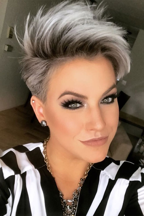 gray hair with black roots edgy pixie haircut with long layers and buzz cut
