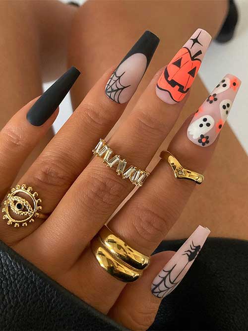 Elegant matte nude Halloween nails with orange pumpkin, ghosts and flowers, a spider, a cobweb, and two accent black nails!