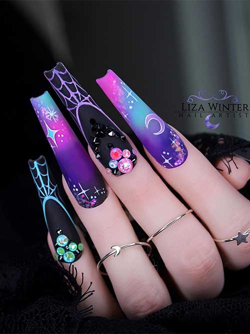 Long elegant Halloween nails with two accent purple light blue pink ombre nails adorned with glitter and colorful rhinestones