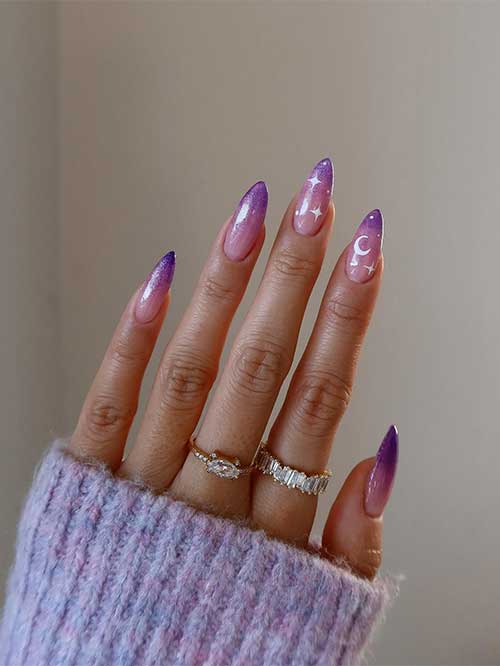 Sparkling long celestial purple ombre nails.