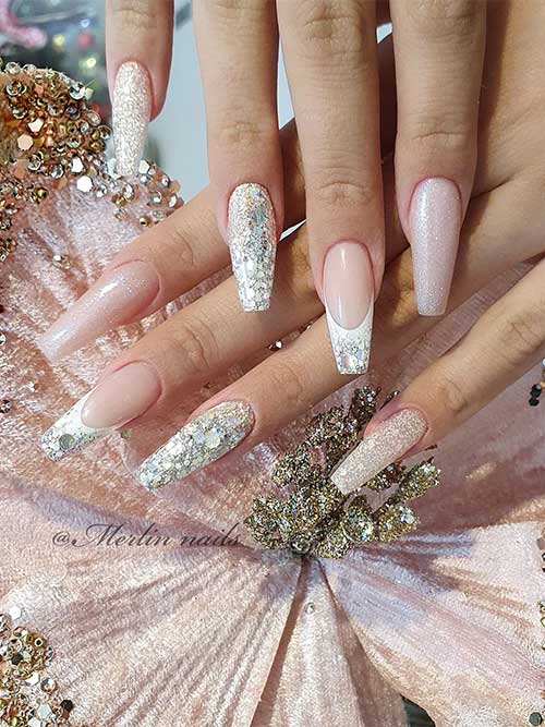 Long coffin-shaped nude nails with silver and gold glitter for the New Year’s celebration