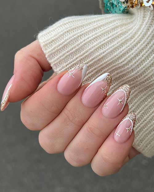Medium almond-shaped white and gold glitter French tip nails with white stars adorned with gold glitter in their centers