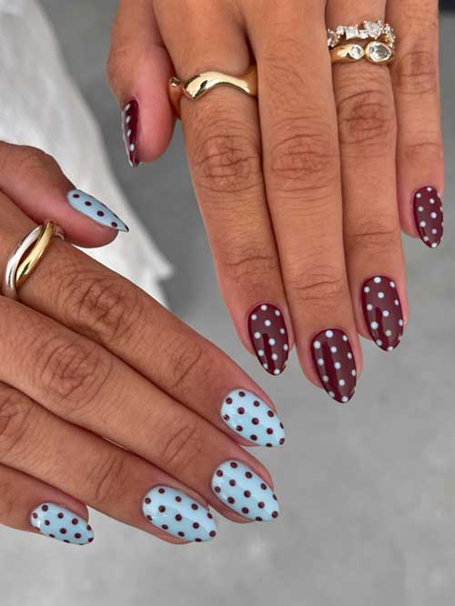 Bold two-handed manicure featuring light blue and red polka dots, almond shape, and elegant gold rings for a chic look. Bold two-handed manicure featuring light blue and red polka dots, almond shape, and elegant gold rings for a chic look.
