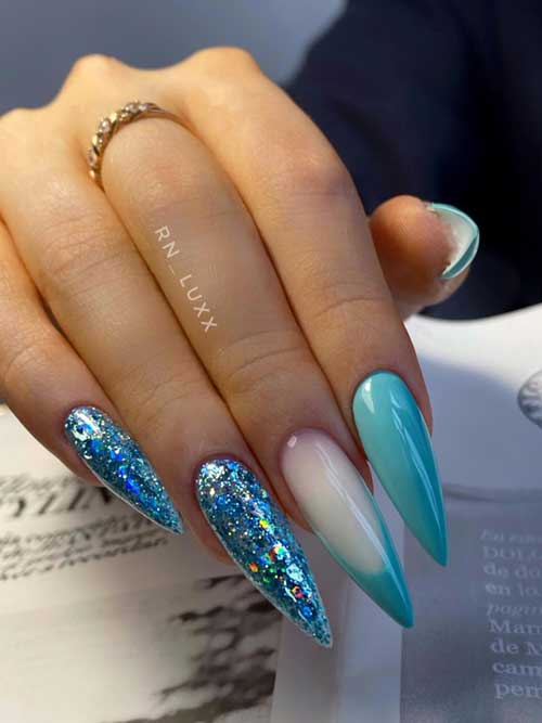 Long stiletto light blue nails with glitter accents and French tips, showcasing elegance and a dreamy, sophisticated vibe. Long stiletto light blue nails with glitter accents and French tips, showcasing elegance and a dreamy, sophisticated vibe.