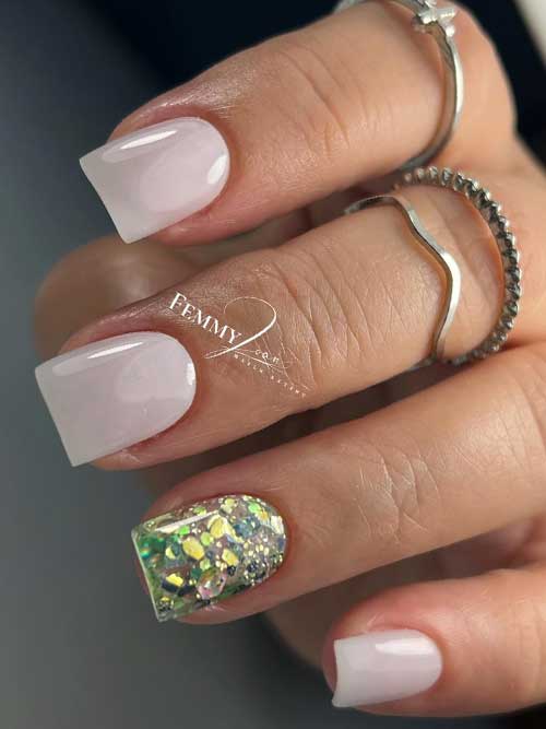 Chic minimalist white nails featuring a glitter accent, combining elegance with a playful touch for a classy appearance. Chic minimalist white nails featuring a glitter accent, combining elegance with a playful touch for a classy appearance.
