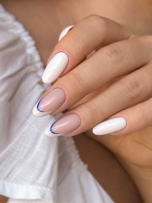 Chic white nails with a modern French manicure and subtle blue accents, perfect for any occasion from brunch to evening out. Chic white nails with a modern French manicure and subtle blue accents, perfect for any occasion from brunch to evening out.