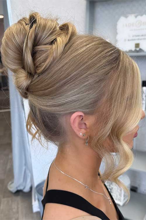 Effortless messy bun with graceful twists and soft waves, perfect for elevating long hairstyles for any special event. Effortless messy bun with graceful twists and soft waves, perfect for elevating long hairstyles for any special event.