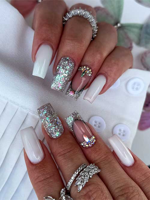 Elegant milky white glitter nails with black-outlined nude accents and rhinestones, perfect for adding sparkle to any outfit. Elegant milky white glitter nails with black-outlined nude accents and rhinestones, perfect for adding sparkle to any outfit.