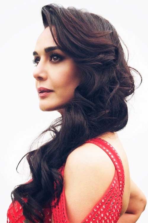 Elegant side-swept curls are the best of long hairstyles for women, offering volume and movement. Elegant side-swept curls are the best of long hairstyles for women, offering volume and movement.