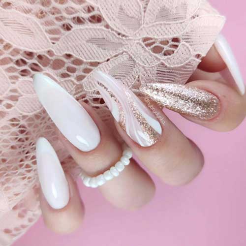 Elegant white manicure with soft pink swirls, bold French tips, and gold glitter, perfect for special occasions. Elegant white manicure with soft pink swirls, bold French tips, and gold glitter, perfect for special occasions.