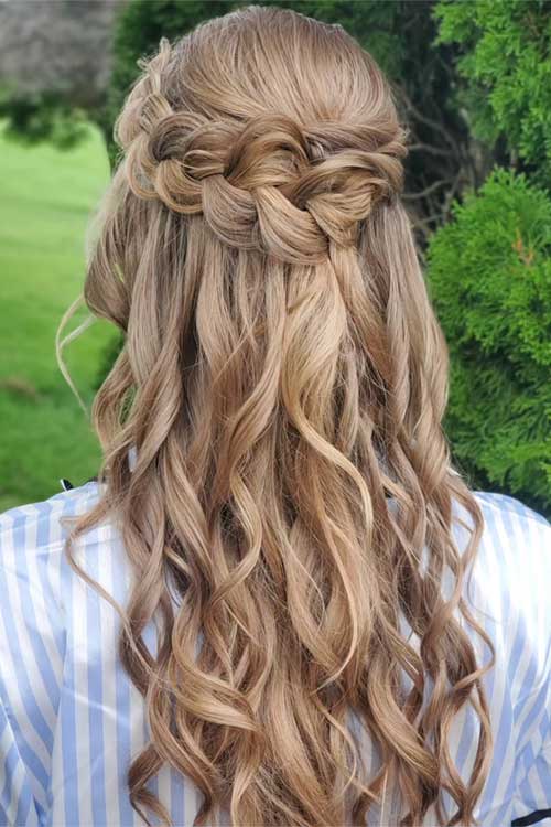 Enchanting Dutch braided crown with flowing curls, perfect for weddings or outdoor events, showcasing caramel tones and elegance. Enchanting Dutch braided crown with flowing curls, perfect for weddings or outdoor events, showcasing caramel tones and elegance.