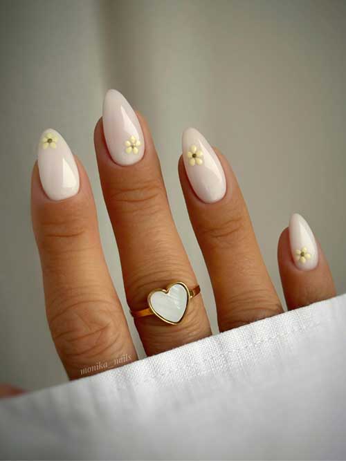 Gel white nails with tiny yellow flowers, offering a fresh, elegant look perfect for everyday wear or spring events. Gel white nails with tiny yellow flowers, offering a fresh, elegant look perfect for everyday wear or spring events.