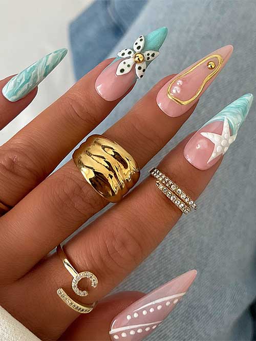Ocean marble nails feature a pastel pink base with turquoise and white swirls, 3D flowers, gold accents, and starfish embellishments. Ocean marble nails feature a pastel pink base with turquoise and white swirls, 3D flowers, gold accents, and starfish embellishments.