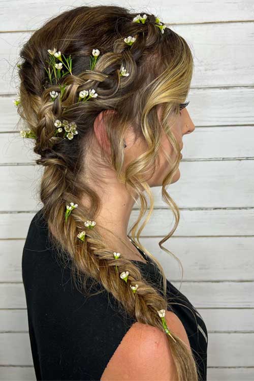 Romantic fishtail braid hairstyle for women, adorned with delicate flowers, perfect for weddings or a fairytale-inspired look. Romantic fishtail braid hairstyle for women, adorned with delicate flowers, perfect for weddings or a fairytale-inspired look.