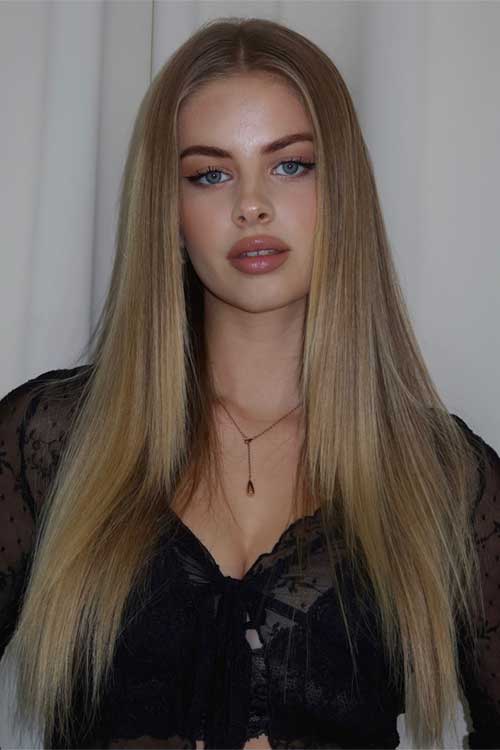 Sleek, polished straight long hairstyles for women in honey-blonde tones, featuring a flawless look. Sleek, polished straight long hairstyles for women in honey-blonde tones, featuring a flawless look.